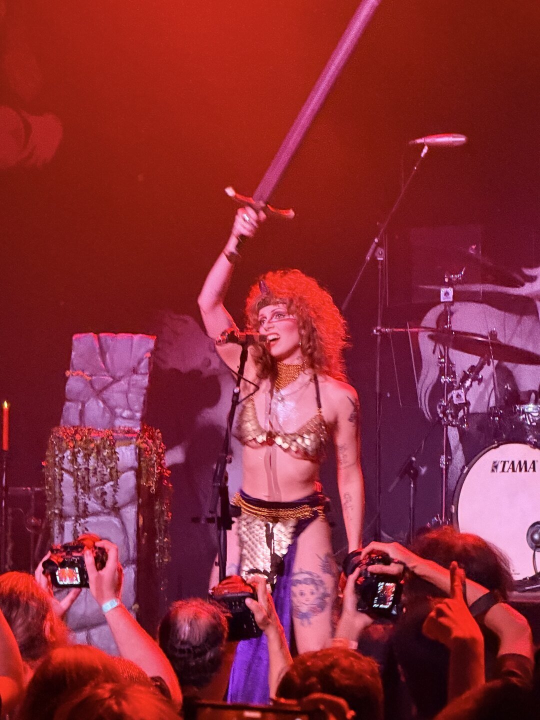 Riley Pinkerton, Castle Rat's Rat Queen, raising a sword at Belasco Theater, Los Angeles, October 1, 2026